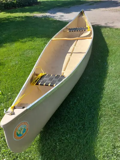 Watson 14 foot prospector style fibreglass canoe 36 inch wide by 13 inches deep, two seats, has a tw...