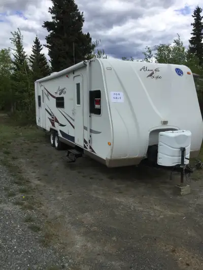Solar charging, new batteries. Awning just replaced. Nice kitchen w/dining slide out. Master bed and...