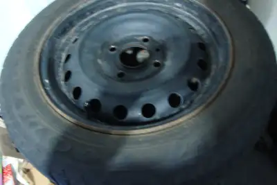 4 used 205/60 R15 Good Year winter tires on 4 bolt rims - should have enough tread left for 1 winter...
