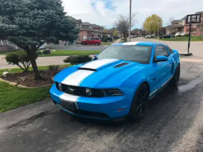 2011 Mustang GT in Grabber blue with white stripping. Car is in excellent condition. Black leather i...