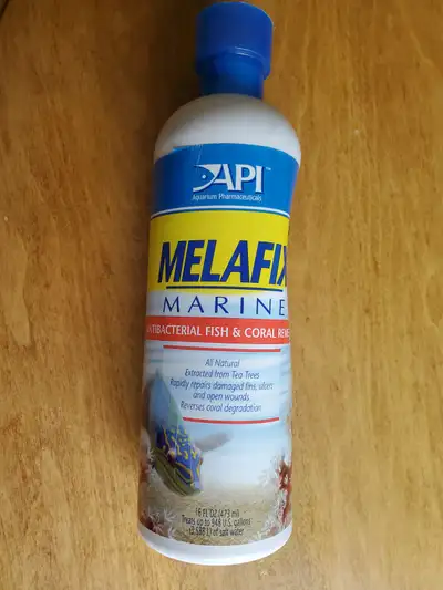 Unopened bottle of Melafix For healing fish and corals
