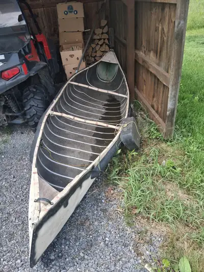 Selling an older canoe that's incredibly lightweight and easy for one person to carry, load, and lau...