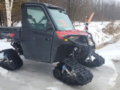 Polaris Ranger 1000 only 1700 kms. New Polaris tracks wiper & washer heated cab- hard doors with rol...