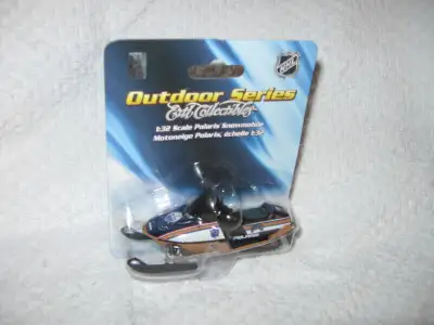 FOR SALE 1/32 scale Edmonton Oilers Polaris snowmobile measures 4in. long and 1 1/2 wide.