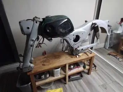 Gas tank, not rusty, seat in very good condition, front fender, forks, swing arm, etc. turn signals,...