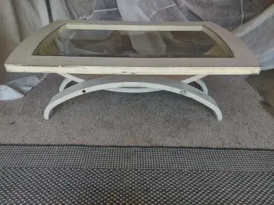 COFFE TABLE WITH A GLASS TOP IN GOOD SHAPE , View more