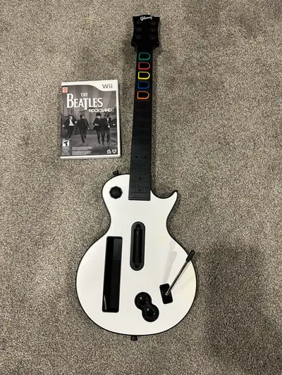 Nintendo wii wireless guitar with rockband 2 game tested and working properly $80 or $70 without the...