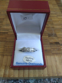 Sterling silver ring with rhodium plated finish and 1 diamond 