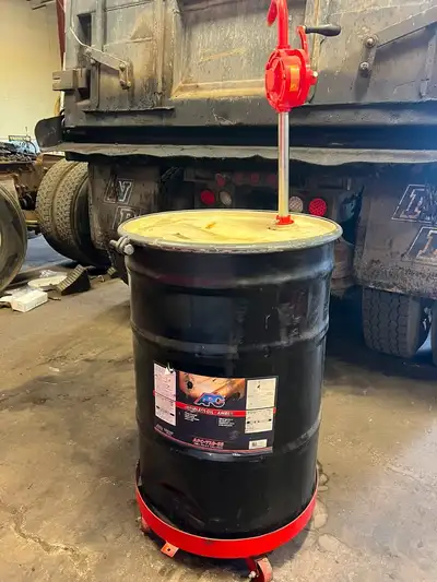 SHOP CLOSING sale Dolly & Hand Pump with 55 Gallon Oil Drum, View more
