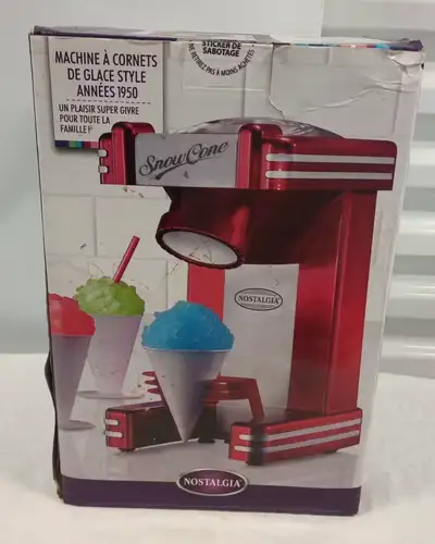 Make refreshing, ice-cold treats with this Nostalgia snow cone maker, perfect for hot summer days. T...