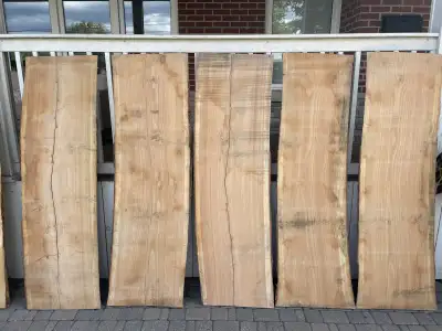 A large selection of honey locust live edge slabs. They have been professionally kiln dried and plan...
