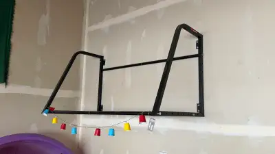 Sturdy wall-mounted tire rack has a 375-lb weight capacity. This black steel frame is adjustable to...