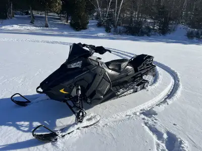 2020 850 Assault low mileage, studded 3/bar. 1.6”track very good condition comes with rack and bag w...