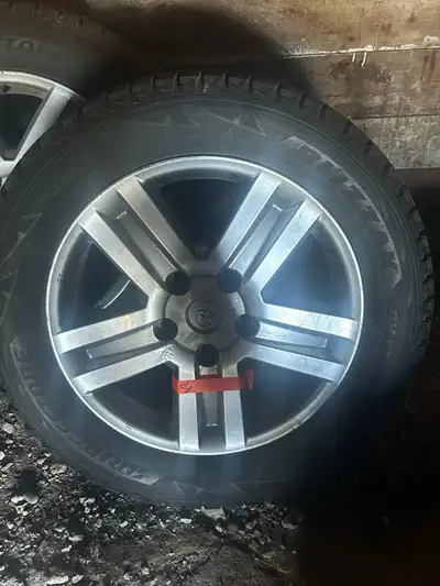 For sale - 4 Toyota Tundra rims and tires. Rims are stock off a 2012 Tundra Crew Max and tires are B...