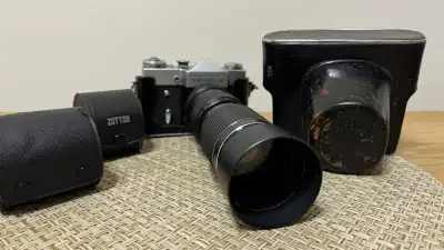 Hello, I have a Zenit B 35mm film camera with half and full cases. Includes a Sun Auto Zoom F/4.5 85...