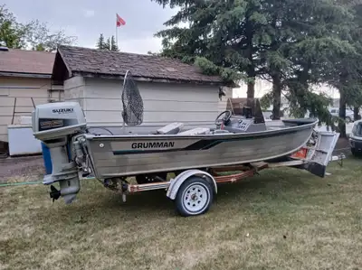 17.5 ft Gruman fishing boat with Suzuki motor. Includes trailer 55 hp oul injected 2 stroke outboard...
