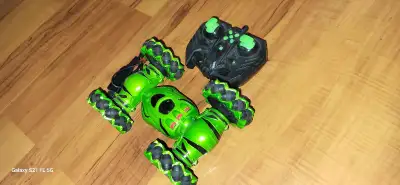 I'm selling a used green RC car that's ready for some high-speed fun! This remote-controlled car is...