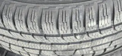 4 like new tires on Mag wheels, Nokian, Nordman Soltice All weather tire , Winter rated with snow fl...