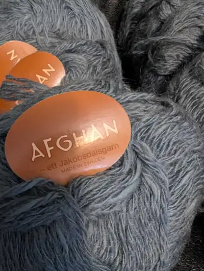 24 balls of yarn. Afghan by Jakobsdal. Made in Sweden Weight says Aran 8 epi. Use 5.5 mm or 9 us nee...