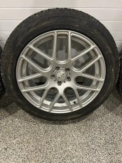 Snow tires with rims and wheel nuts. Came off Nissan Murano will fit lots of others great shape