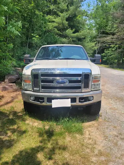 2010 f350 only 185k, leather seats, white camo interior, 6.4 with chip, intake, exhaust done. 35" ti...