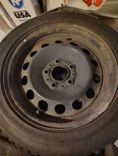 Winter Bridgestone Blizzak LM-22 Size 205/55R16 91H. Mounted on a black steel rim. These were used o...