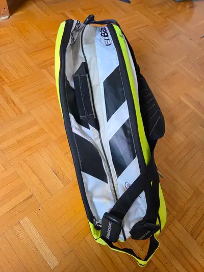 This is a well-loved Babolat tennis racket bag, ready to carry your gear to the court! Please note i...