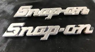 -Snap On metal emblems/badges (KN860) -Snap On logo replacement badges -L 8” W 1.5” -Both have all 3...