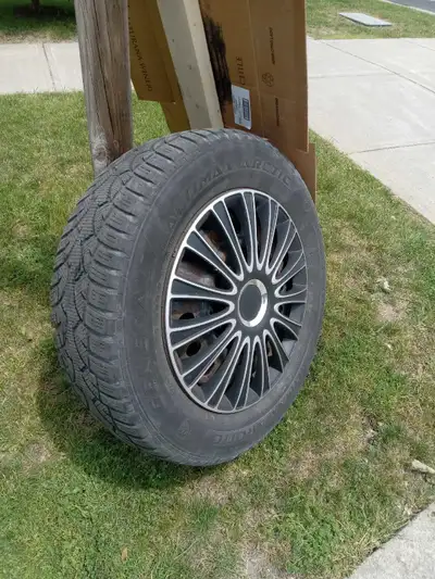 4 Winter tires ,rims and covers. 225/65 17"