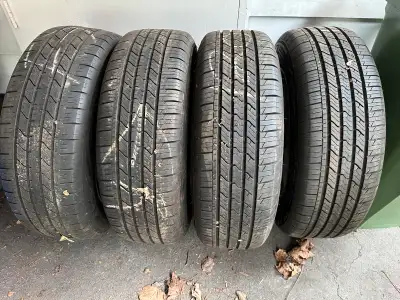 Selling a set of 4 all-season tires (size 215/65R17) mounted on rims, previously used sporadically....