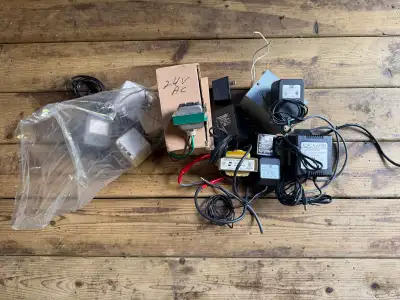 This lot includes a variety of electronic power adapters and transformers, all in used condition. 24...