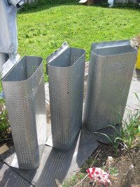 One of three HD metal bins with perforating on the rounded side.