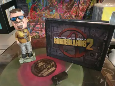 Marcus Bobblehead and the "Inside the Vault: The Art & Design of Borderlands 2" book from the Border...