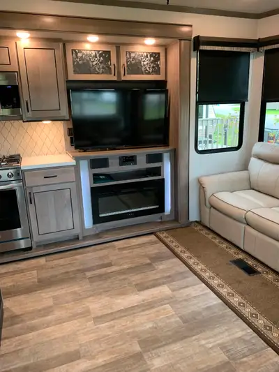 2021 Cedar Creek Park model RV, aluminum construction, stainless steel appliances, heat pump, 2 air...