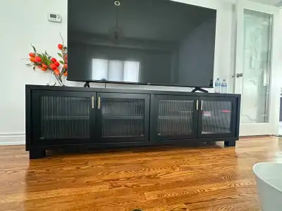 Selling a 75” Hisense TV with an Ashley TV stand as a bundle. Clean, modern setup and ready to use....