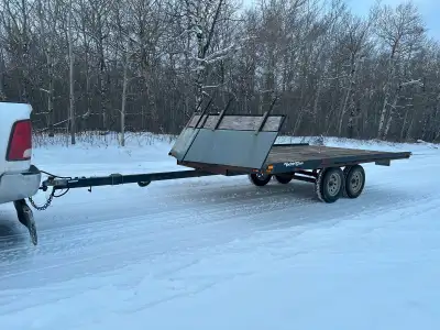 Selling my 2005 3 place sled trailer it is a drive on drive off model with tandem axles has brakes a...