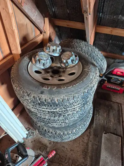 Tires are at 50 to 60 % tread left . Rims are steel with chrome skin on exterior . Only 3 caps one i...