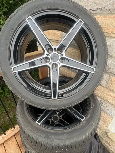 Get ready to roll with these sleek 20-inch rims, sporting tires with a 275/40R20 106W specification!...