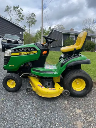 John Deere D140 22hp v-twin 48” deck Hydrostatic transmission Electric PTO Cruise control Wide tires...