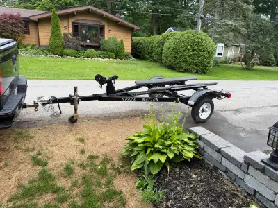 Seadoo single trailer, has new safety chain lights wiring wheel bearing winch, tires are good $800 c...