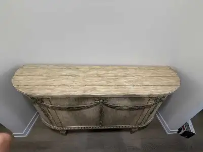 Add a touch of elegance to your home with this decorative half-moon console table, perfect for entry...
