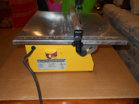 7 INCH TILE SAW GOOD COND.