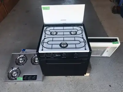 Rv stove $200 stove incert $20 RV stove hood $20 .Located in Dutton .