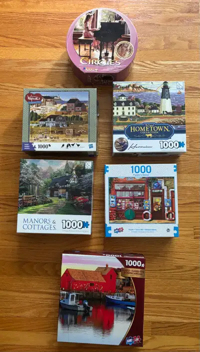 Challenge your mind with this collection of six pre-owned 1000-piece jigsaw puzzles featuring divers...