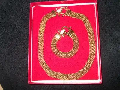 Kenneth Jay Lane mesh necklace and bracelet set in original box. Decorative crystal clasp on both.
