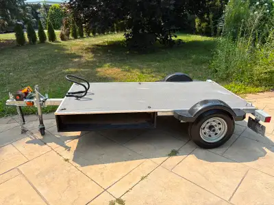 Utility flat platform trailer used mostly for transporting motorcycles. $1000 as seen $800 without t...