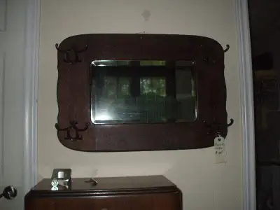 THIS OAK ANTIQUE MIRROR HAS 4 BULL SHAPED HANGERS (BRASS).. DIMENSIONS ARE 32" WIDE or across by 22...