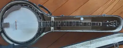 Odyssey 5-String Banjo, professionally tricked up with a heavy brass tone ring, which at the time I...