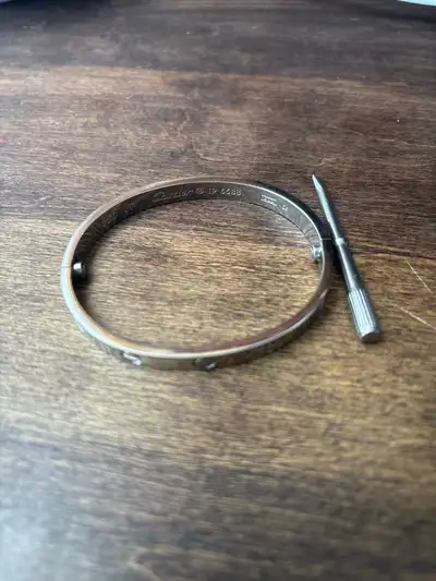 Silver Cartier Love bracelet replica waterproof and in good condition. Engraved and comes with match...