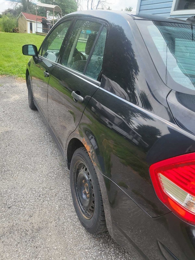 Nissan versa 2009 — photo 3